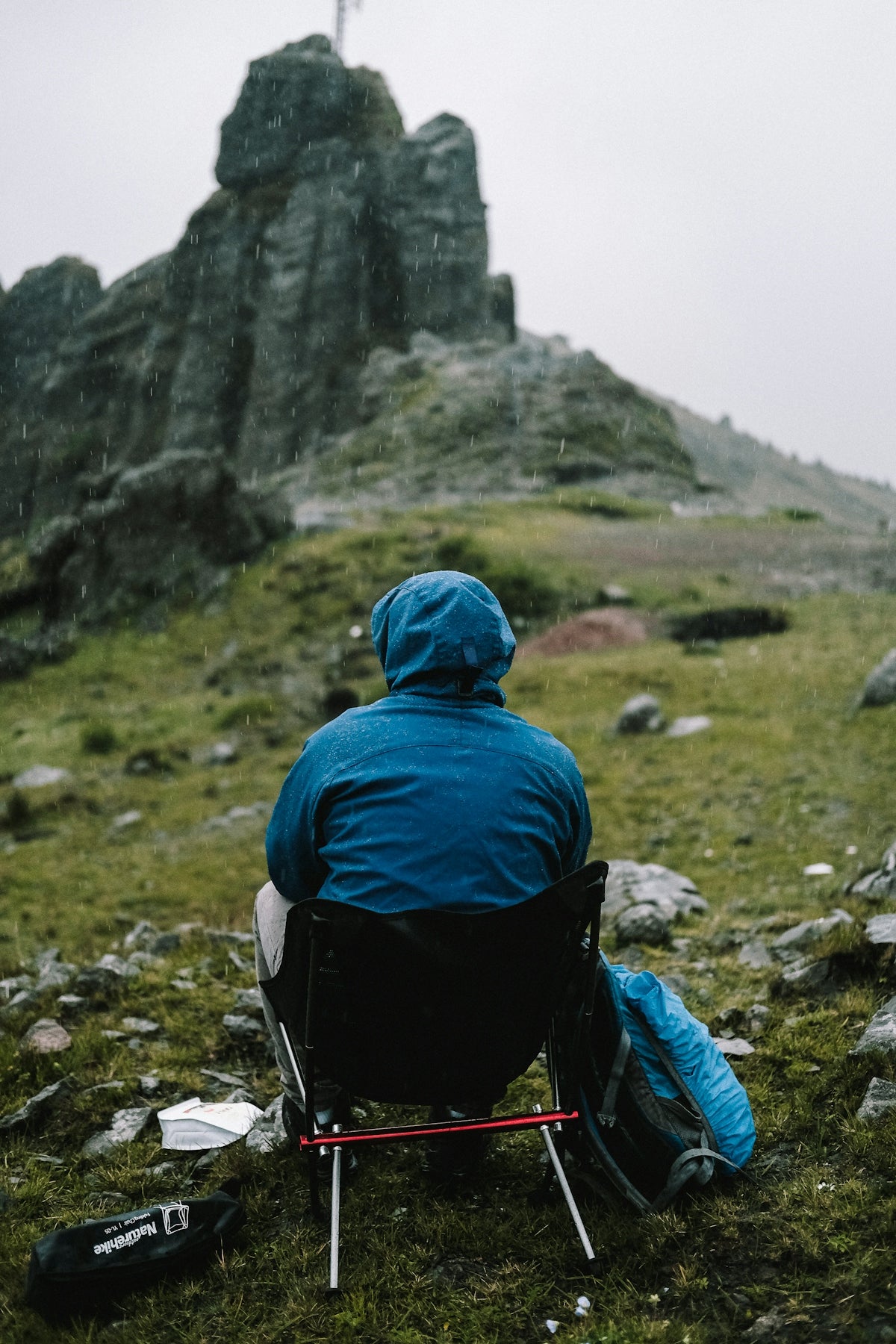 a person sitting in a chair outside