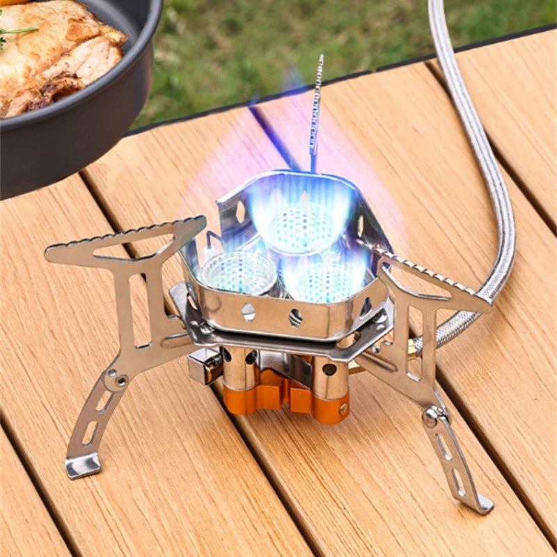 Estufa de camping portátil de 3 quemadores: estufa de gas butano resistente al viento con encendido para cocinar al aire libre.